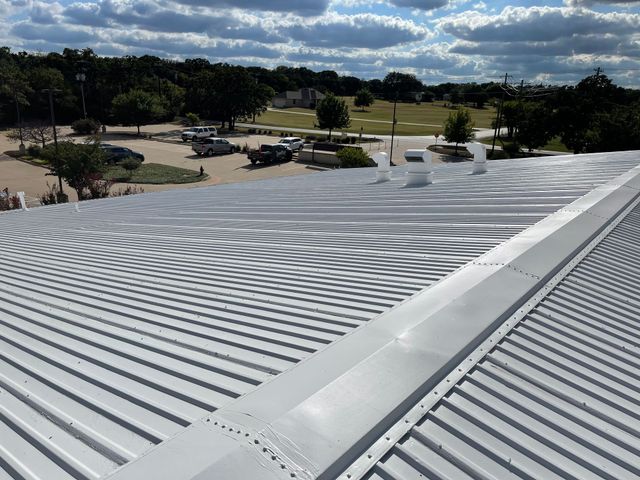 Burleson, TX — White Elastomeric metal roof coating, commercial building