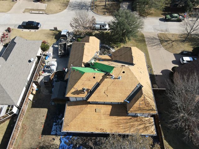 Burleson, TX — All roofs are torn down to the deck.